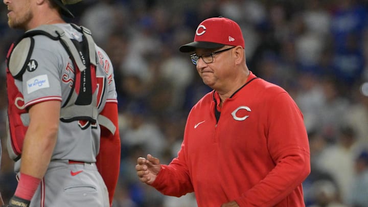 Oct 1, 2025; Los Angeles, California, USA; Cincinnati Reds manager Terry Francona (77) makes a pitching change against the Los Angeles Dodgers in the seventh inning during game two of the Wildcard round for the 2025 MLB playoffs at Dodger Stadium. Mandatory Credit: Jayne Kamin-Oncea-Imagn Images