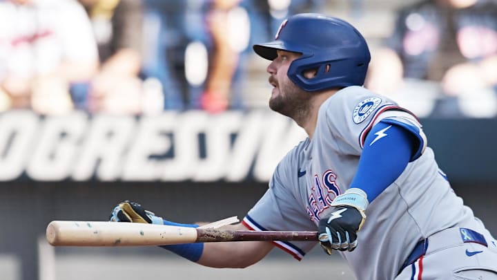 Texas Rangers first baseman Jake Burger (21) hits an RBI single during the third inning against the Cleveland Guardians at Progressive Field. 
