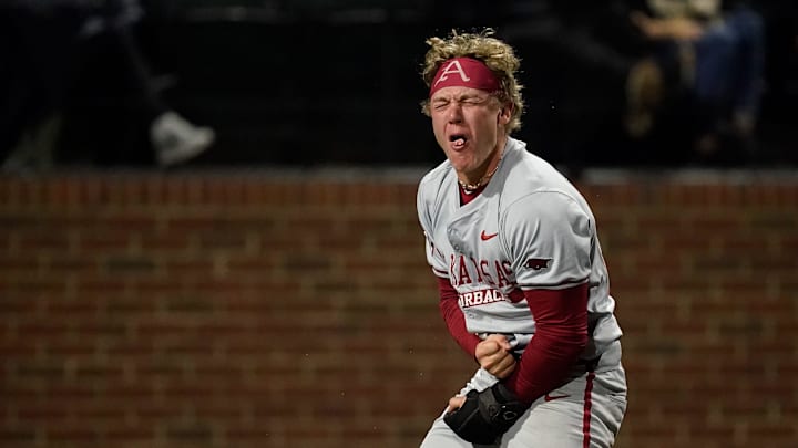 Arkansas left fielder Charles Davalan (24) reacts after he safely reached home against Vanderbilt on a double hit by Kuhio Aloy during the ninth inning at Hawkins Field in Nashville, Tenn., Friday, March 28, 2025.