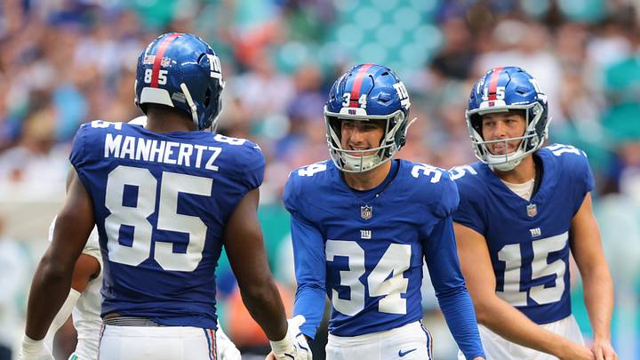 Aug 22, 2026; Miami Gardens, Florida, USA; New York Giants kicker Dominic Zvada (34) celebrates with tight end Chris Manhertz (85) after scoring a field goal against the Miami Dolphins during the first half at Hard Rock Stadium.  