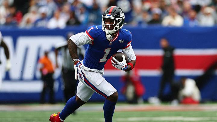 Oct 4, 2026; East Rutherford, New Jersey, USA;  New York Giants wide receiver Malik Nabers (1) runs the ball during the third quarter at MetLife Stadium.   