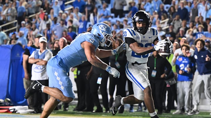 Nov 22, 2025; Chapel Hill, North Carolina, USA; Duke Blue Devils running back Nate Sheppard (20) scores during the second half at Kenan Stadium. Mandatory Credit: William Howard-Imagn Images