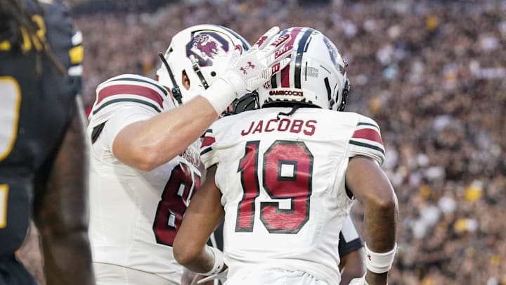 Sep 20, 2025; Columbia, Missouri, USA; South Carolina Gamecocks wide receiver Vandrevius Jacobs (19) celebrates with team mates after scoring against the Missouri Tigers during the first half of the game at Faurot Field at Memorial Stadium. Mandatory Credit: Denny Medley-Imagn Images