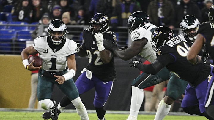 Dec 1, 2024; Baltimore, Maryland, USA; Philadelphia Eagles quarterback Jalen Hurts (1) rushes during the second  half  against the Baltimore Ravens at M&T Bank Stadium. Mandatory Credit: Tommy Gilligan-Imagn Images