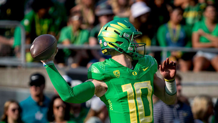 Oregon quarterback Bo Nix throws out a pass during warm ups as the Oregon Ducks host Hawaii