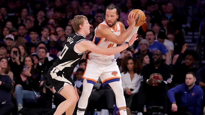 Jan 12, 2025; New York, New York, USA; New York Knicks guard Jalen Brunson (11) controls the ball against Milwaukee Bucks guard AJ Green (20) during the fourth quarter at Madison Square Garden. Mandatory Credit: Brad Penner-Imagn Images