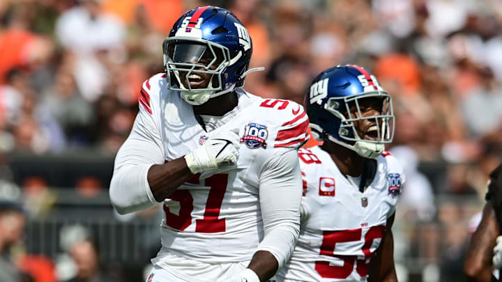 Sep 22, 2024; Cleveland, Ohio, USA; New York Giants linebacker Bobby Okereke (58) and New York Giants linebacker Azeez Ojulari (51) celebrate after a sack during the first quarter against the Cleveland Browns at Huntington Bank Field. Mandatory Credit: Ken Blaze-Imagn Images