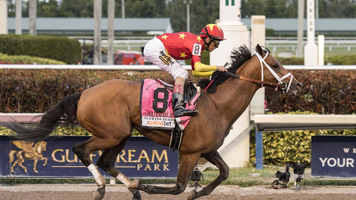 Mar 31, 2018; Hallandale Beach, FL, USA; John Velazquez (8) aboard Audible trained by Todd Pletcher crosses the finish line and wins the 67th running of the Florida Derby at Gufstream Park. 