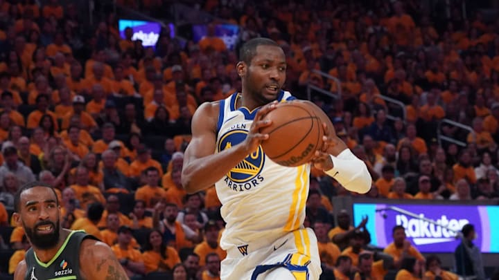 May 10, 2025; San Francisco, California, USA; Golden State Warriors forward Jonathan Kuminga (00) grabs a rebound in front of Minnesota Timberwolves guard Mike Conley (10) in the second quarter during game three in the second round of the 2025 NBA Playoffs at Chase Center. Mandatory Credit: David Gonzales-Imagn Images