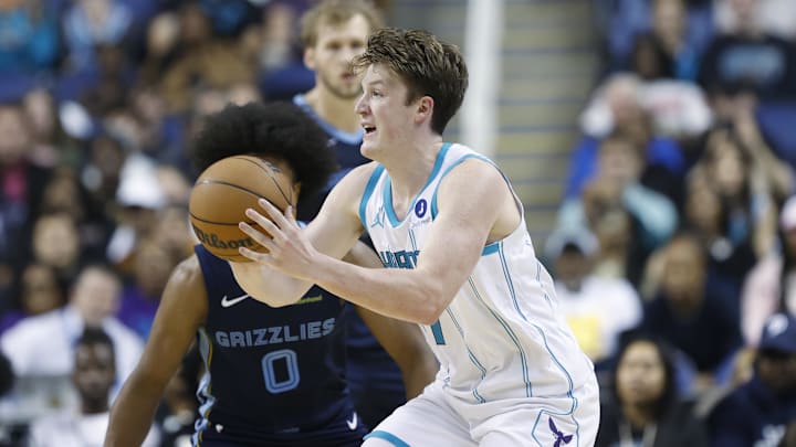 Oct 15, 2025; Greensboro, North Carolina, USA; Charlotte Hornets guard/forward Kon Knueppel (7) passes the ball during the second half against the Memphis Grizzlies at First Horizon Coliseum. Mandatory Credit: Brian Westerholt-Imagn Images