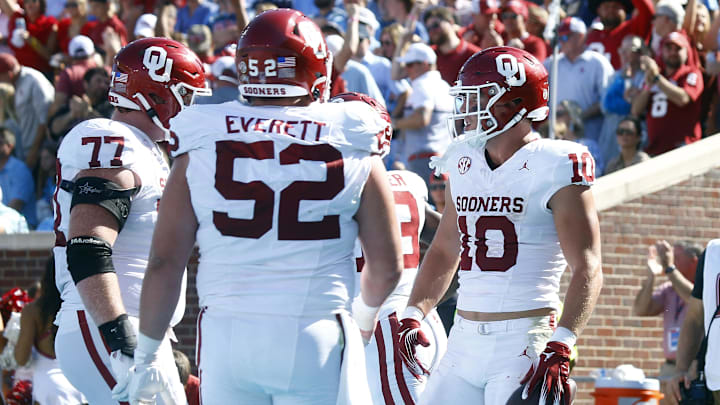 Oct 26, 2024; Oxford, Mississippi, USA; Oklahoma Sooners tight end Bauer Sharp (10) reacts with offensive linemen Heath Ozaeta (77) and Troy Everett (52) after a touchdown during the first half against the Mississippi Rebels at Vaught-Hemingway Stadium. Mandatory Credit: Petre Thomas-Imagn Images