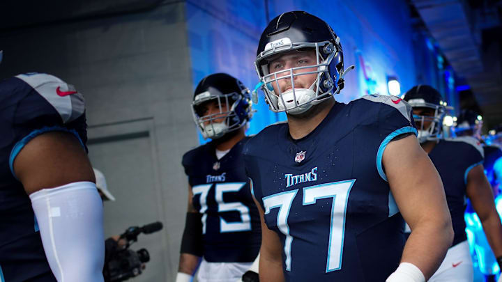 Tennessee Titans rookie offensive tackle Peter Skoronski (77) heads out for warm ups before their game against Carolina Panthers at Nissan Stadium in Nashville on Nov. 26, 2023.