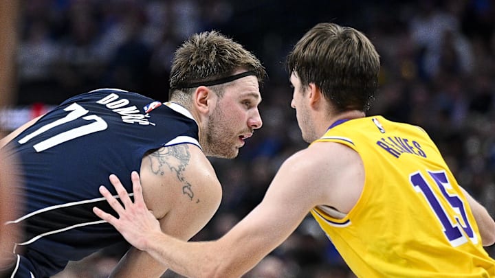 Dec 12, 2023; Dallas, Texas, USA; Dallas Mavericks guard Luka Doncic (77) and Los Angeles Lakers guard Austin Reaves (15) in action during the game between the Dallas Mavericks and the Los Angeles Lakers at the American Airlines Center. Mandatory Credit: Jerome Miron-Imagn Images