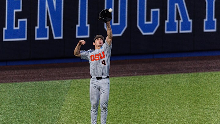 Jun 8, 2024; Lexington, KY, USA; A ball bounces over Oregon State Beavers infielder Dallas Macias (4) in the outfield during the eighth inning against the Kentucky Wildcats at Kentucky Proud Park. Mandatory Credit: Jordan Prather-Imagn Images