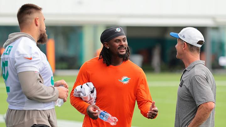 Miami Dolphins quarterback Malik Willis (2) speaks to New York Giants head coach John Harbaugh and Miami Dolphins defensive tackle Zach Sieler (92) after a joint practice at the Baptist Health Training Complex.