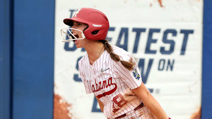 Alabama's Lauren Johnson (18) celebrates a score in the third inning of the Women's College World Series game between the Alabama and Florida at Devon Park in Oklahoma City, Sunday, June, 2, 2024.
