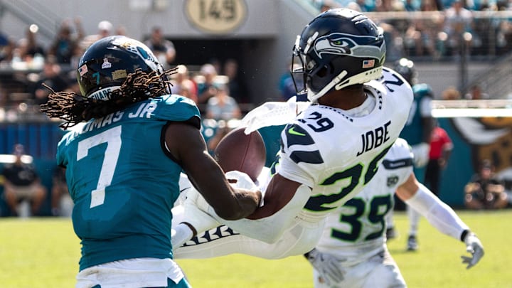 Jacksonville Jaguars wide receiver Brian Thomas Jr. (7) and Seattle Seahawks cornerback Josh Jobe (29) battle for a pass during the third quarter in an NFL football game at EverBank Stadium, Sunday, Oct. 12, 2025, in Jacksonville, Fla. [Doug Engle/Florida Times-Union]