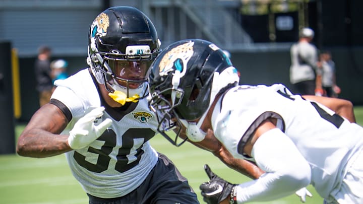 Jacksonville Jaguars cornerback Montaric Brown (30) and Jacksonville Jaguars cornerback Christian Braswell (21) runs drills during the fourth organized team activity at the Miller Electric Center in Jacksonville, Fla. Tuesday, May 27, 2025. [Doug Engle/Florida Times-Union]