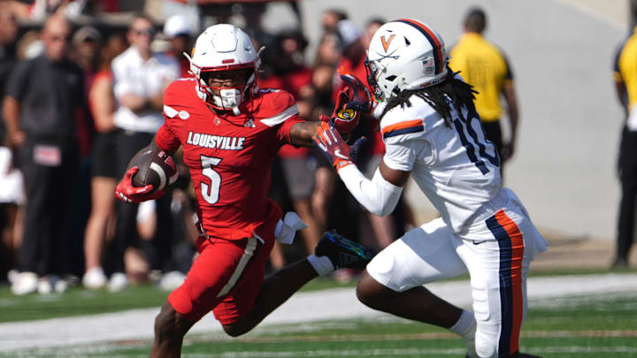 Louisville’s Caullin Lacy runs against Virginia’s Ja’Son Prevard at L&N Stadium on Saturday, Oct. 4, 2025 Louisville’s Caullin Lacy runs against Virginia’s Ja’Son Prevard at L&N Stadium on Saturday, Oct. 4, 2025