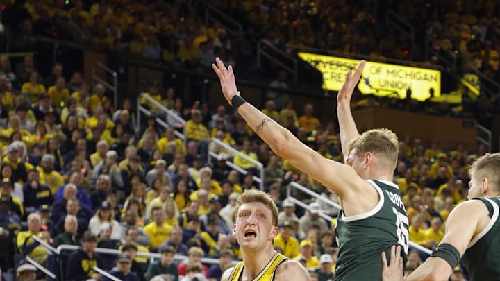 Feb 21, 2025; Ann Arbor, Michigan, USA; Michigan Wolverines center Danny Wolf (1) drives to the basket during the first half against the Michigan State Spartans at Crisler Center. Mandatory Credit: Brian Bradshaw Sevald-Imagn Images