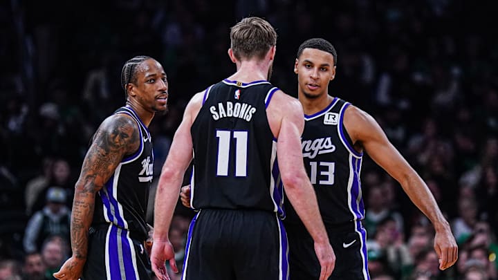 Jan 10, 2025; Boston, Massachusetts, USA; Sacramento Kings forward DeMar DeRozan (10), forward Keegan Murray (13) and forward Domantas Sabonis (11) react after defeating the Boston Celtics at TD Garden. Mandatory Credit: David Butler II-Imagn Images