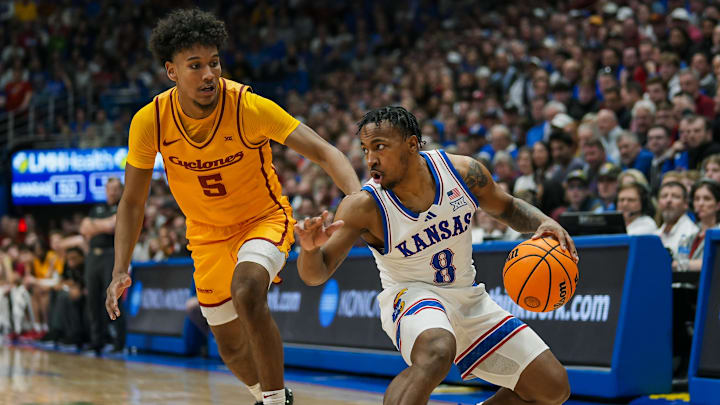 Feb 3, 2025; Lawrence, Kansas, USA; Kansas Jayhawks guard David Coit (8) dribbles the ball against Iowa State Cyclones guard Curtis Jones (5) during the second half at Allen Fieldhouse. Mandatory Credit: Jay Biggerstaff-Imagn Images