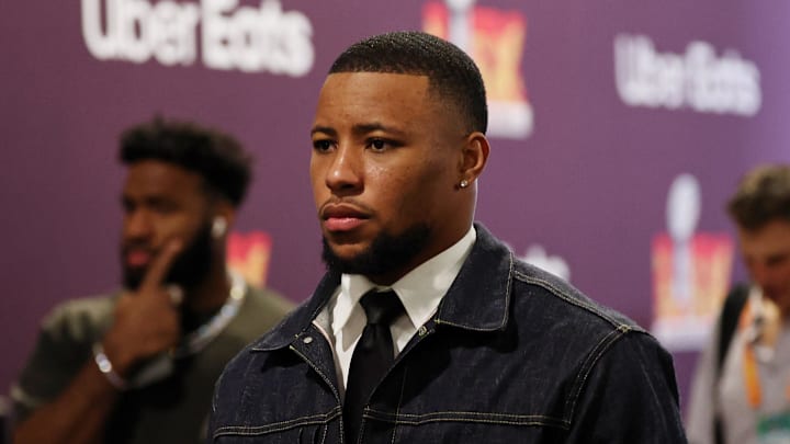 Philadelphia Eagles running back Saquon Barkley (26) arrives before Super Bowl LIX.