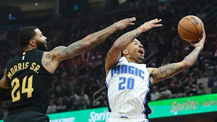 May 5, 2024; Cleveland, Ohio, USA; Orlando Magic guard Markelle Fultz (20) drives to the basket against Cleveland Cavaliers forward Marcus Morris Sr. (24) during the first half in game seven of the first round for the 2024 NBA playoffs at Rocket Mortgage FieldHouse. Mandatory Credit: Ken Blaze-Imagn Images May 5, 2024; Cleveland, Ohio, USA; Orlando Magic guard Markelle Fultz (20) drives to the basket against Cleveland Cavaliers forward Marcus Morris Sr. (24) during the first half in game seven of the first round for the 2024 NBA playoffs at Rocket Mortgage FieldHouse. Mandatory Credit: Ken Blaze-Imagn Images