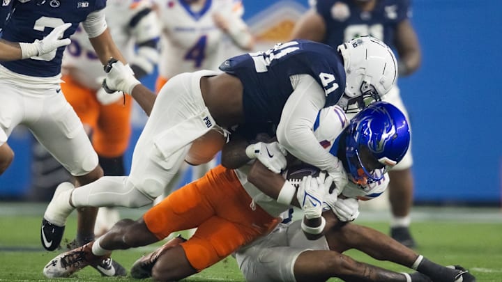 Penn State Nittany Lions linebacker Kobe King tackles Boise State Broncos wide receiver Prince Strachan during the Fiesta Bowl at State Farm Stadium. Penn State Nittany Lions linebacker Kobe King tackles Boise State Broncos wide receiver Prince Strachan during the Fiesta Bowl at State Farm Stadium.
