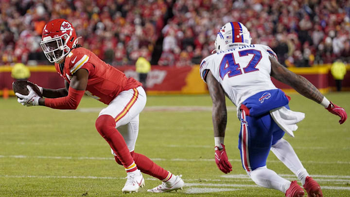 Dec 10, 2023; Kansas City, Missouri, USA; Kansas City Chiefs wide receiver Rashee Rice (4) catches a pass as Buffalo Bills cornerback Christian Benford (47) defends during the game at GEHA Field at Arrowhead Stadium. Mandatory Credit: Denny Medley-Imagn Images