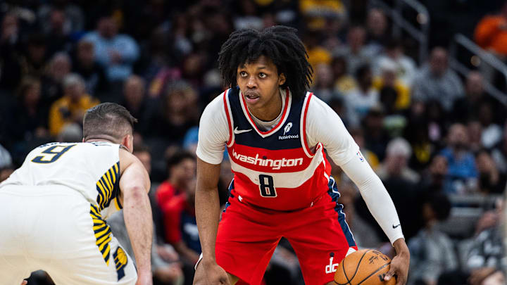 Apr 8, 2025; Indianapolis, Indiana, USA; Washington Wizards guard Bub Carrington (8) dribbles the ball while  Indiana Pacers guard T.J. McConnell (9) defends in the second half at Gainbridge Fieldhouse. Mandatory Credit: Trevor Ruszkowski-Imagn Images
