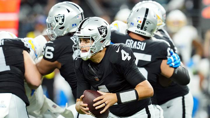Dec 14, 2023; Paradise, Nevada, USA; Las Vegas Raiders quarterback Aidan O'Connell (4) controls the ball in the fourth quarter against the Los Angeles Chargers at Allegiant Stadium. Mandatory Credit: Stephen R. Sylvanie-USA TODAY Sports