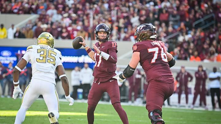 Oct 17, 2026; Blacksburg, Virginia, USA;  Virginia Tech Hokies quarterback Ethan Grunkemeyer (17) throws a pass as Georgia Tech Yellow Jackets linebacker Braylon Outlaw (35) applies pressure during the second quarter at Lane Stadium.  Mandatory Credit: Brian Bishop-Imagn Images