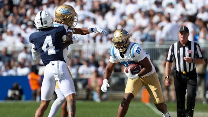 Oct 5, 2024; University Park, Pennsylvania, USA; UCLA Bruins tight end Bryce Pierre (87) runs with the ball during the fourth quarter against the Penn State Nittany Lions at Beaver Stadium. Mandatory Credit: Matthew O'Haren-Imagn Images Oct 5, 2024; University Park, Pennsylvania, USA; UCLA Bruins tight end Bryce Pierre (87) runs with the ball during the fourth quarter against the Penn State Nittany Lions at Beaver Stadium. Mandatory Credit: Matthew O'Haren-Imagn Images