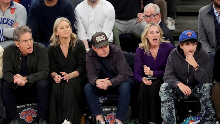 Apr 21, 2025; New York, New York, USA; American actors Ben Stiller (left to right) and Christine Taylor sit courtside next to Canadian-American actor and activist Michael J. Fox and his wife Tracy Pollan and French-American actor Timothee Chalamet during the fourth quarter of game two of the first round of the 2024 NBA Playoffs between the New York Knicks and the Detroit Pistons at Madison Square Garden. Mandatory Credit: Brad Penner-Imagn Images
