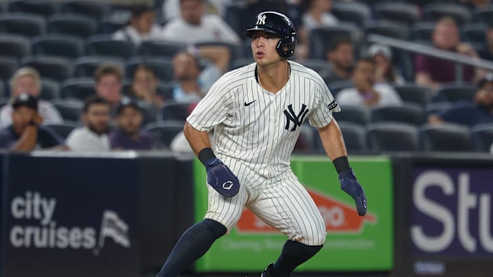 Aug 13, 2025; Bronx, New York, USA; New York Yankees shortstop Anthony Volpe (11) takes a lead during the seventh inning against the Minnesota Twins at Yankee Stadium. Mandatory Credit: Vincent Carchietta-Imagn Images