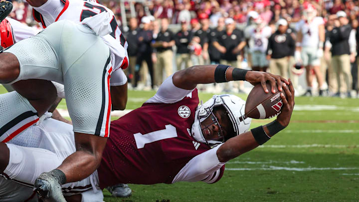 Nov 8, 2025; Starkville, Mississippi, USA; Mississippi State Bulldogs quarterback Kamario Taylor (1) runs for a touchdown against the Georgia Bulldogs during the first half at Davis Wade Stadium at Scott Field. Mandatory Credit: Wesley Hale-Imagn Images