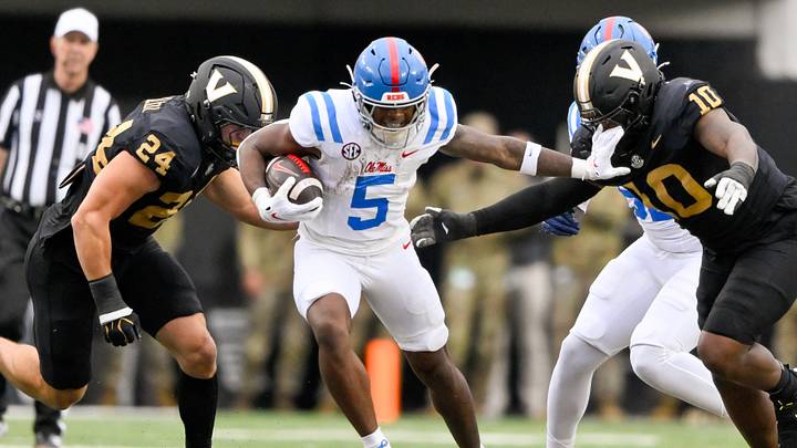 Mississippi Rebels running back Kewan Lacy stiff-arms Vanderbilt Commodores edge Brian Allen Jr. Mississippi Rebels running back Kewan Lacy stiff-arms Vanderbilt Commodores edge Brian Allen Jr.