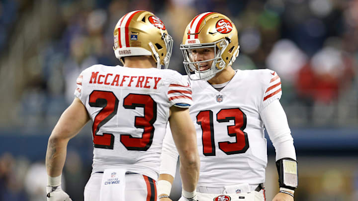 San Francisco 49ers running back Christian McCaffrey (23) and quarterback Brock Purdy (13)