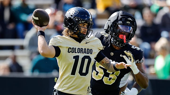Apr 19, 2025; Boulder, CO, USA; Colorado Buffaloes quarterback Julian Lewis (10) and defensive end Arden Walker (53) during the spring game at Folsom Field. Mandatory Credit: Isaiah J. Downing-Imagn Images