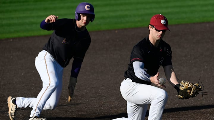 MBA’s Jack Elrod (6) tries to catch a throw from catcher Hayes Tyrrell as Clarksville's Kirk Weatherford (25) steals third base in the third inning of a high school baseball game Tuesday, April 8, 2025, in Nashville, Tenn.
