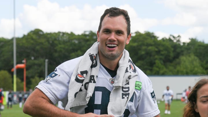 Jun 10, 2024; Foxborough, MA, USA;  New England Patriots tight end Hunter Henry (85) walks to the microphones for a press conference after minicamp at Gillette Stadium. Mandatory Credit: Eric Canha-USA TODAY Sports