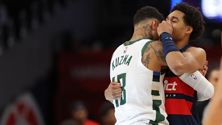 Feb 21, 2025; Washington, District of Columbia, USA; Former teammates Milwaukee Bucks forward Kyle Kuzma (18) and Washington Wizards guard Jordan Poole (13) hug prior to their game at Capital One Arena. Mandatory Credit: Geoff Burke-Imagn Images