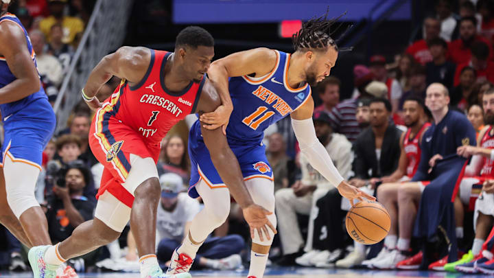 Oct 28, 2023; New Orleans, Louisiana, USA; New Orleans Pelicans forward Zion Williamson (1) attempts to steal the ball from New York Knicks guard Jalen Brunson (11) in the third quarter at Smoothie King Center. Mandatory Credit: Matthew Dobbins-Imagn Images