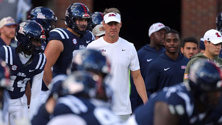 Nov 8, 2025; Oxford, Mississippi, USA; Mississippi Rebels head coach Lane Kiffin looks on during warm ups prior to the game against The Citadel Bulldogs at Vaught-Hemingway Stadium. Mandatory Credit: Petre Thomas-Imagn Images Nov 8, 2025; Oxford, Mississippi, USA; Mississippi Rebels head coach Lane Kiffin looks on during warm ups prior to the game against The Citadel Bulldogs at Vaught-Hemingway Stadium. Mandatory Credit: Petre Thomas-Imagn Images