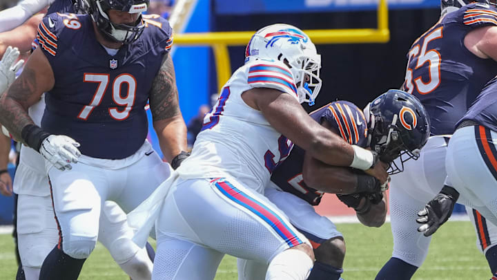Aug 10, 2024; Orchard Park, New York, USA; Buffalo Bills defensive tackle DeWayne Carter (90) tackles Chicago Bears running back Khalil Herbert (24)