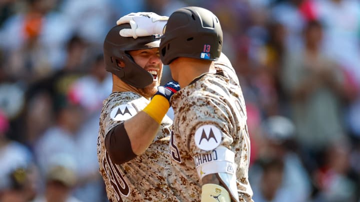 Jul 4, 2025; San Diego, California, USA; San Diego Padres third baseman Manny Machado (13) celebrates with San Diego Padres left fielder Gavin Sheets (30) after hitting a one run home run during the fourth inning against the Texas Rangers at Petco Park. Mandatory Credit: David Frerker-Imagn Images Jul 4, 2025; San Diego, California, USA; San Diego Padres third baseman Manny Machado (13) celebrates with San Diego Padres left fielder Gavin Sheets (30) after hitting a one run home run during the fourth inning against the Texas Rangers at Petco Park. Mandatory Credit: David Frerker-Imagn Images