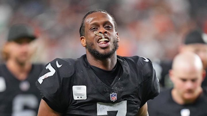 Nov 23, 2025; Paradise, Nevada, USA; Las Vegas Raiders quarterback Geno Smith (7) walks off the field after the Cleveland Browns defeated the Raiders 24-10 at Allegiant Stadium. Mandatory Credit: Stephen R. Sylvanie-Imagn Images