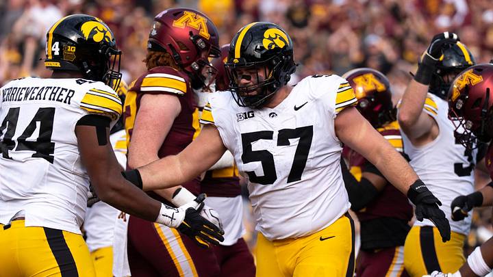 Iowa Hawkeyes defensive lineman Will Hubert (57) high-fives Iowa Hawkeyes defensive lineman Kenneth Merrieweather (44) Oct. 24, 2026 during a Big Ten football game against the Minnesota Golden Gophers in Minneapolis, Minnesota. Iowa Hawkeyes defensive lineman Will Hubert (57) high-fives Iowa Hawkeyes defensive lineman Kenneth Merrieweather (44) Oct. 24, 2026 during a Big Ten football game against the Minnesota Golden Gophers in Minneapolis, Minnesota.