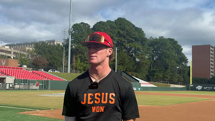 NC State infielder Luke Nixon in a 'Jesus Won' shirt from Patrick Bailey. NC State infielder Luke Nixon in a 'Jesus Won' shirt from Patrick Bailey.